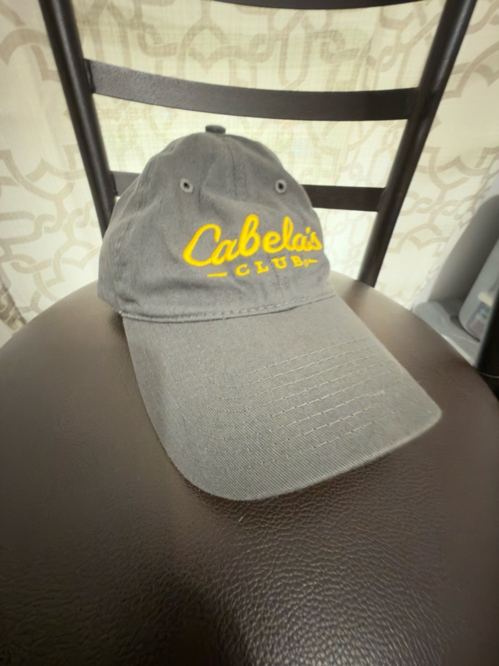 Cabela's Gray Cap with Yellow Logo on Green Tag